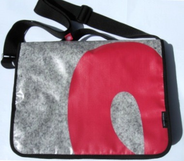 A recycled laptop bag made out of Powershop's Electricity vs Power billboard campaign